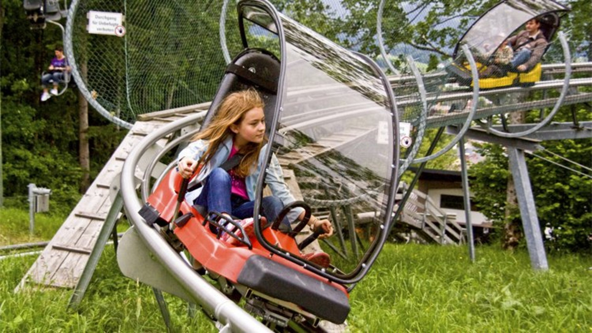 Alpine Coaster on the Wurbauerkogel | Photo: TVB Pyhrn-Priel / Sulzbacher A girl on the Alpine Coaster on Wurbauerkogel.